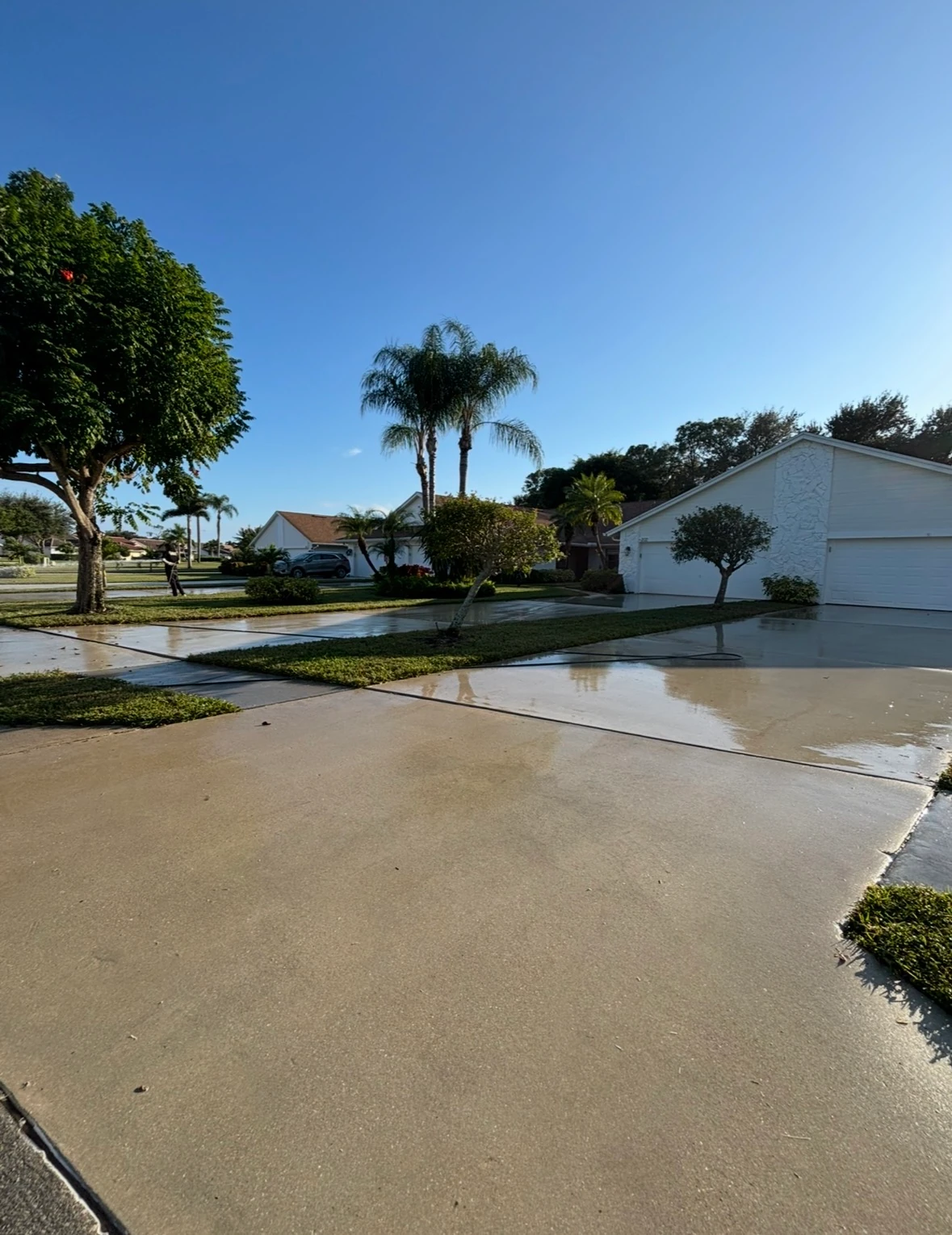 Concrete driveway after a complete SNR pressure-washing job, oil stains and grime removed