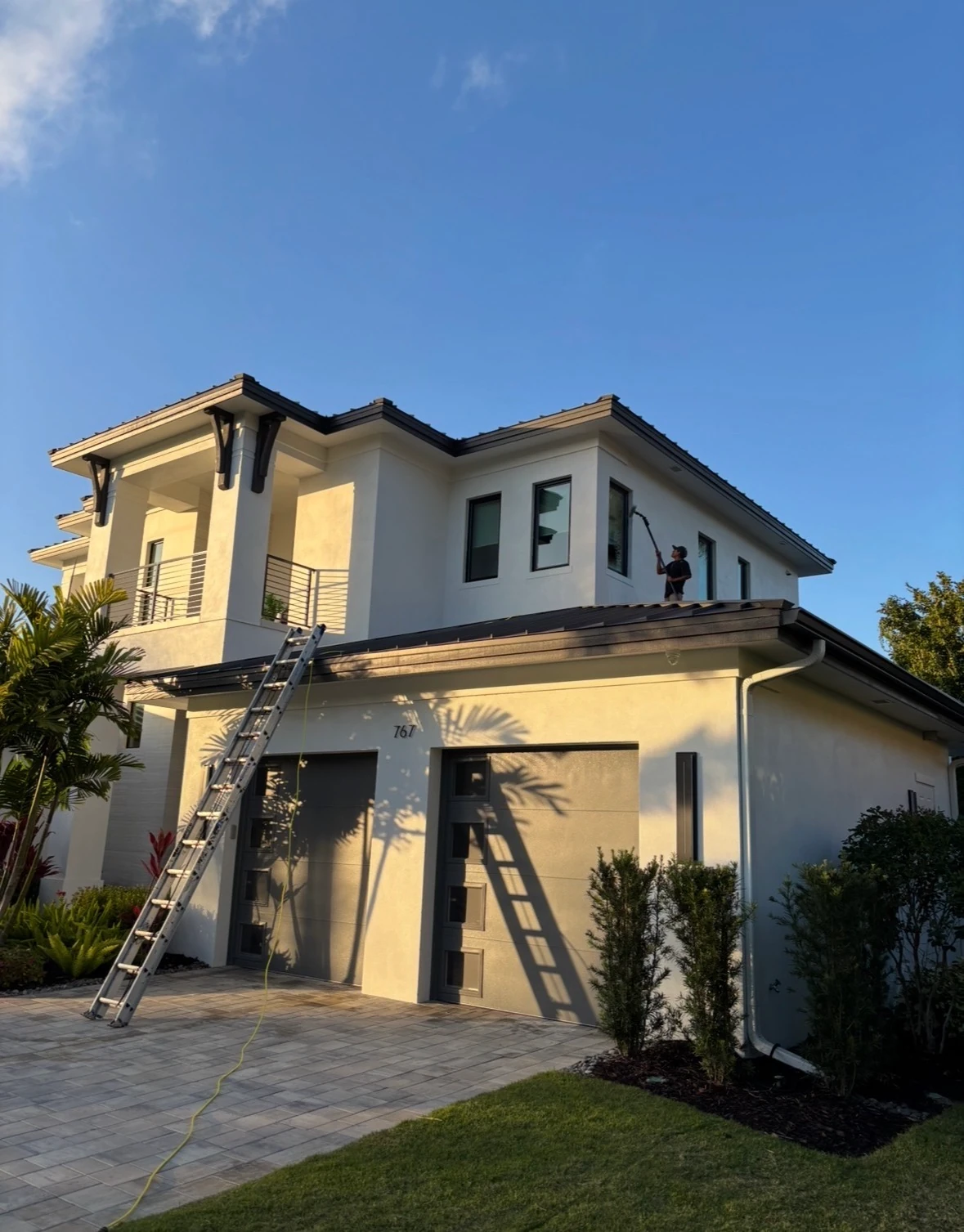 Painted home exterior after professional SNR soft washing, with curb appeal restored