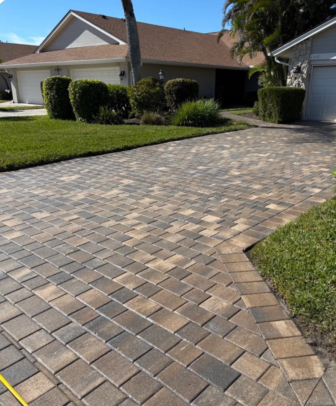 Paver walkway after SNR cleaning and sealing, with refreshed color and tight joints