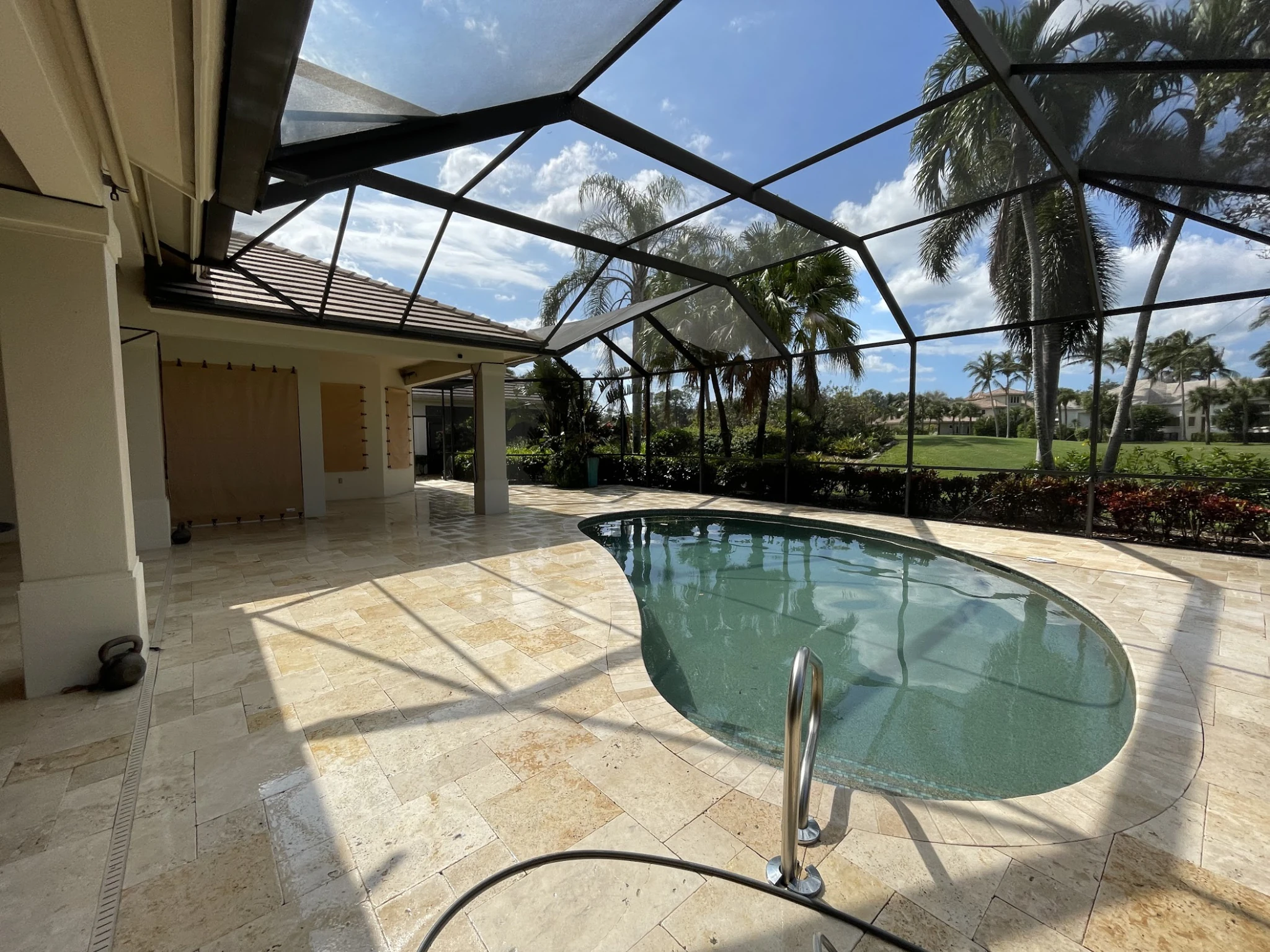 Pool deck after pressure washing, looking bright, clean, and like new