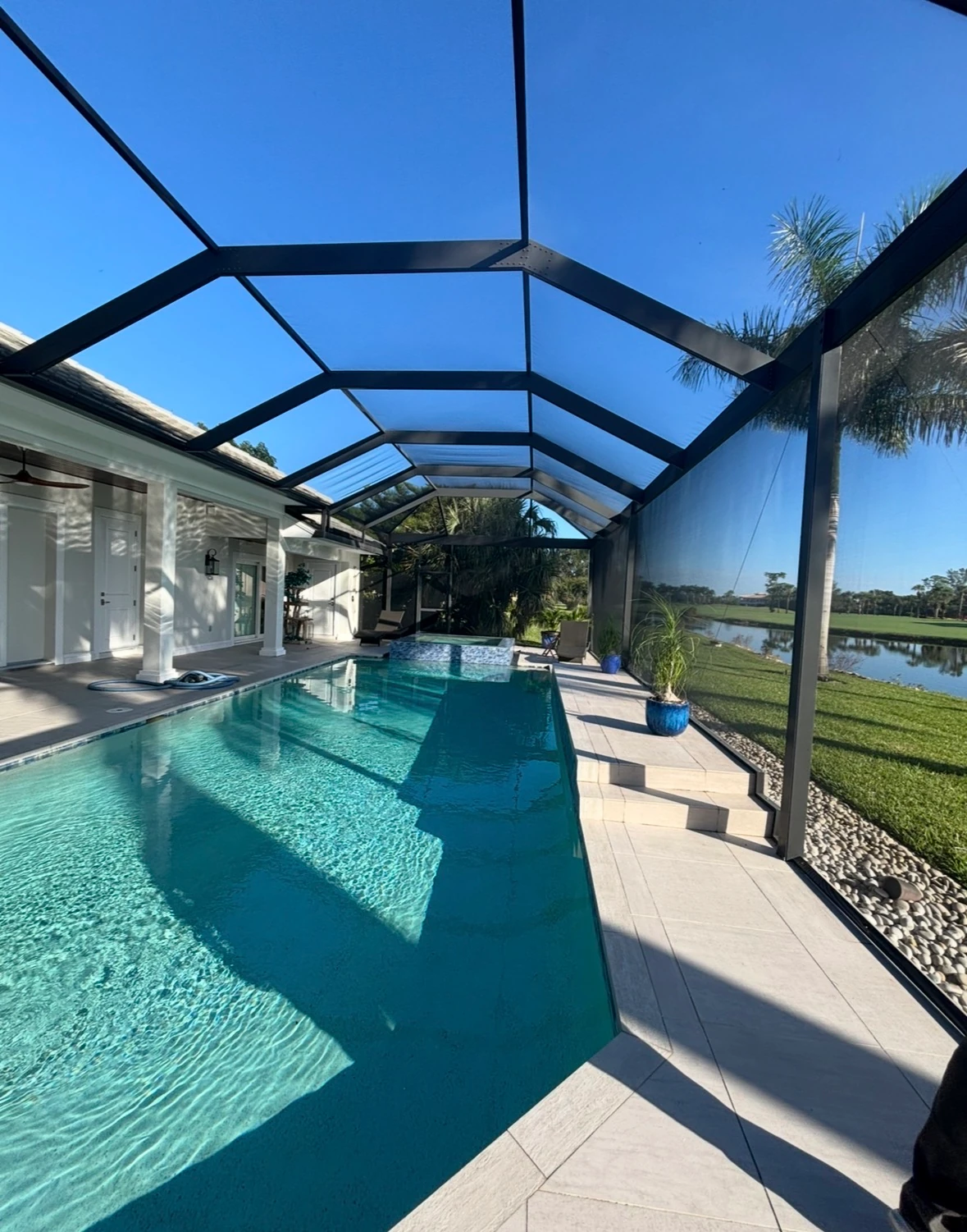 Pool deck after professional SNR pressure washing, restored to a bright, slip-resistant finish