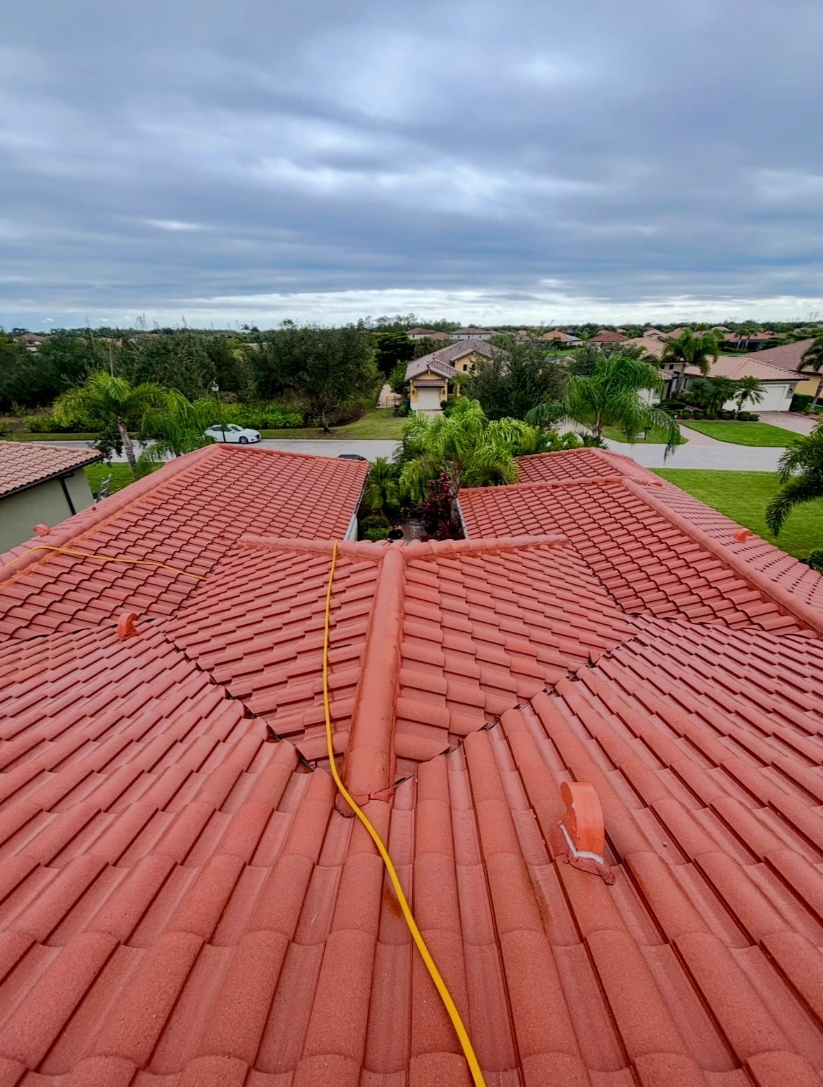 Tile roof after professional SNR soft washing, with algae and black streaks removed